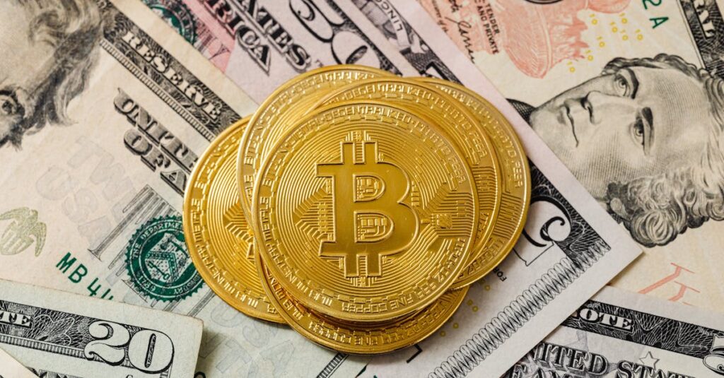 Close-up of gold bitcoin coins on US paper money, representing cryptocurrency investment.
